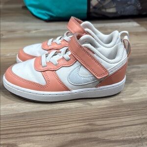 Kids' Coral and White Nike sneakers